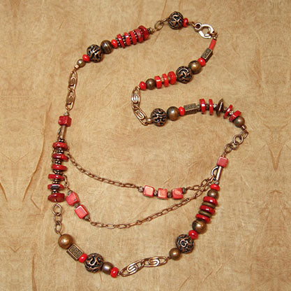 G-26 Two asymmetrical chains and coral beads added a final unique touch to what I think is a stunning necklace!
