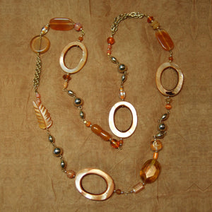H-31 The summertime hues of peach, yellow, orange and amber dominate this necklace.