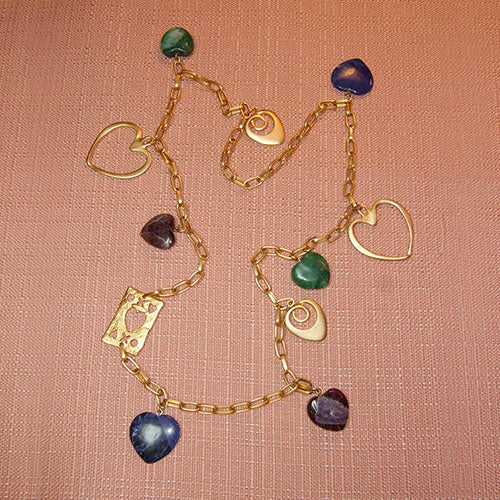 H-32 A simple brushed gold chain link necklace with gemstone and metal hearts.