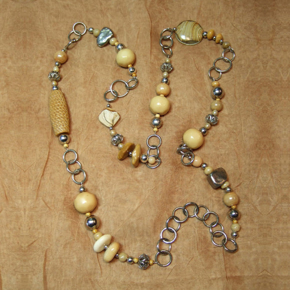 H-43 Here’s another warm weather necklace in neutral shades of off white, beige and tan.