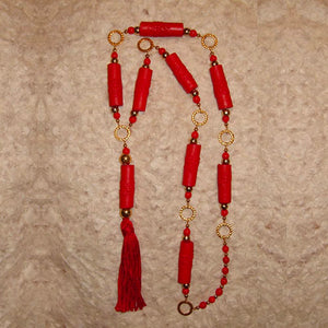 I-5 Wear this bright red accent piece all year long! The unusual circular...