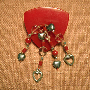 P-110 Vintage plastic button with clear glass and silver heart charms.