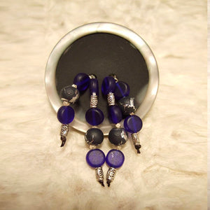 P-116 Cobalt blue glass and Bali silver beads on a gun-metal-and-pearl finish button.