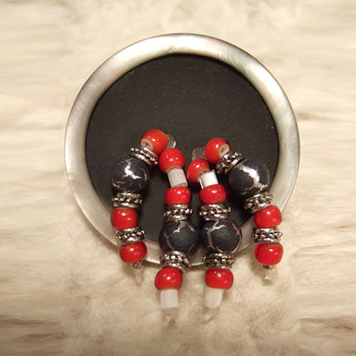 P-117 Red glass and Bali silver beads on a gun-metal-and-pearl finish button.