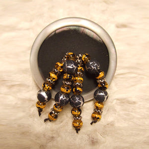 P-120 Bali silver, yellow and black glass beads on gun-metal-and-pearl finish.