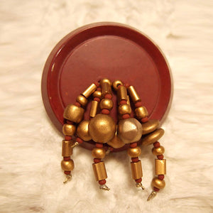 P-125 Brushed gold and Czech glass seed beads on a bakelite button