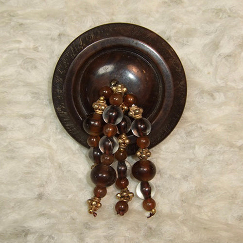 P-94 Indian gold and German glass beads on a vintage button.