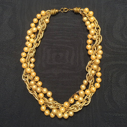 M-46 Large and small gold chains draw eyes instantly to this necklace...