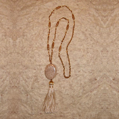 S-13 Love the neutral tones of this necklace! The tasseled pendant...